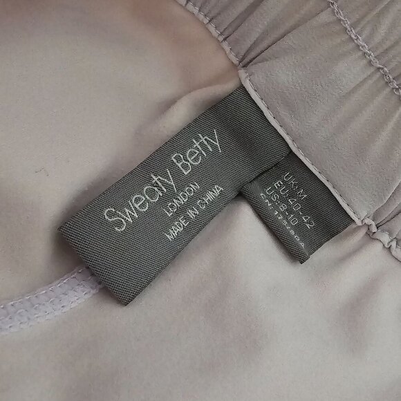 SWEATY BETTY Swift Running Shorts Drawstring Lined Pockets Cream/Pink Women 8/10 - Picture 3 of 9